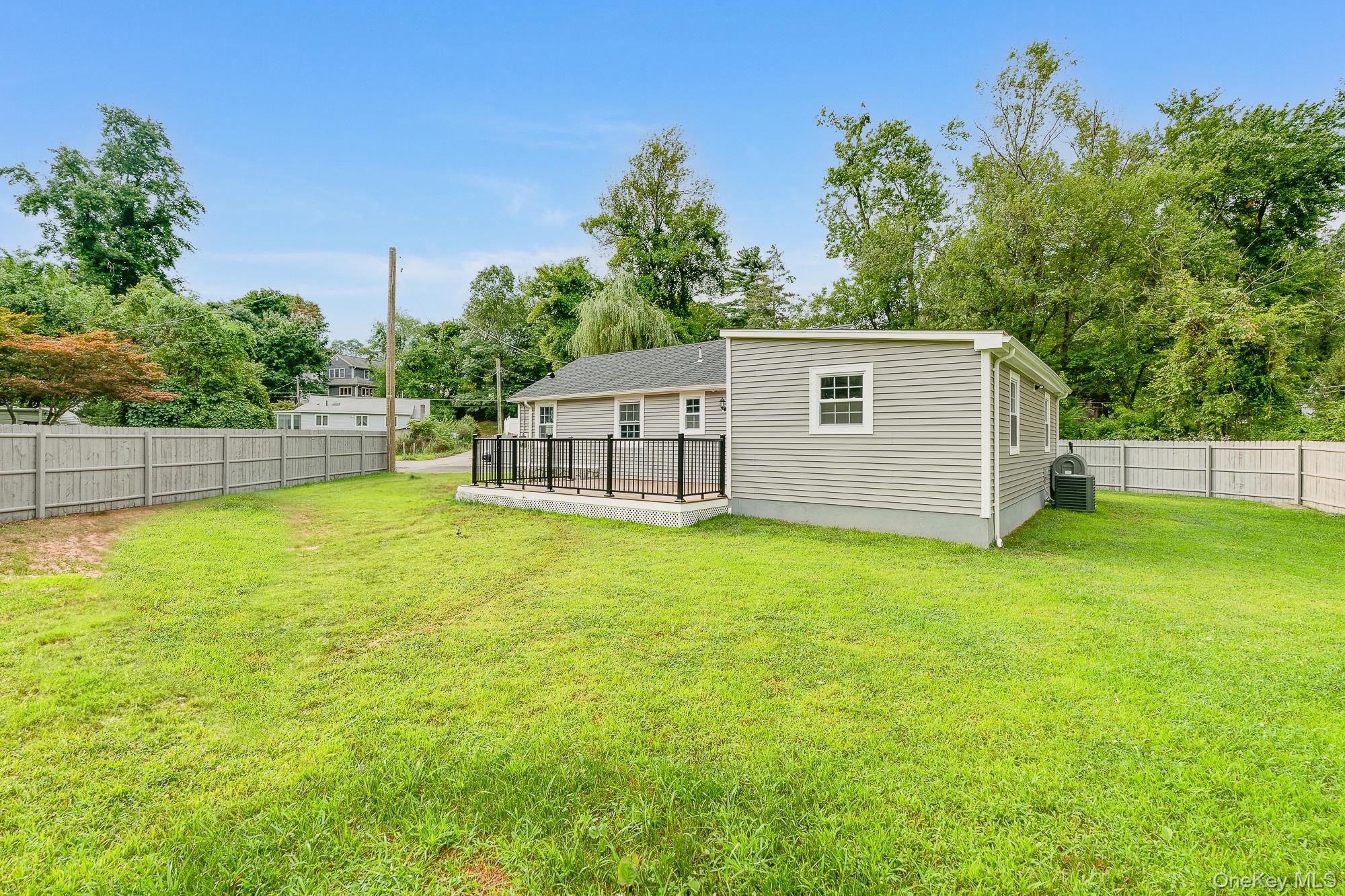3167 Lincoln Drive Mohegan Lake, NY 10547 - Photo 24 of 34 a view of a backyard with a garden and plants