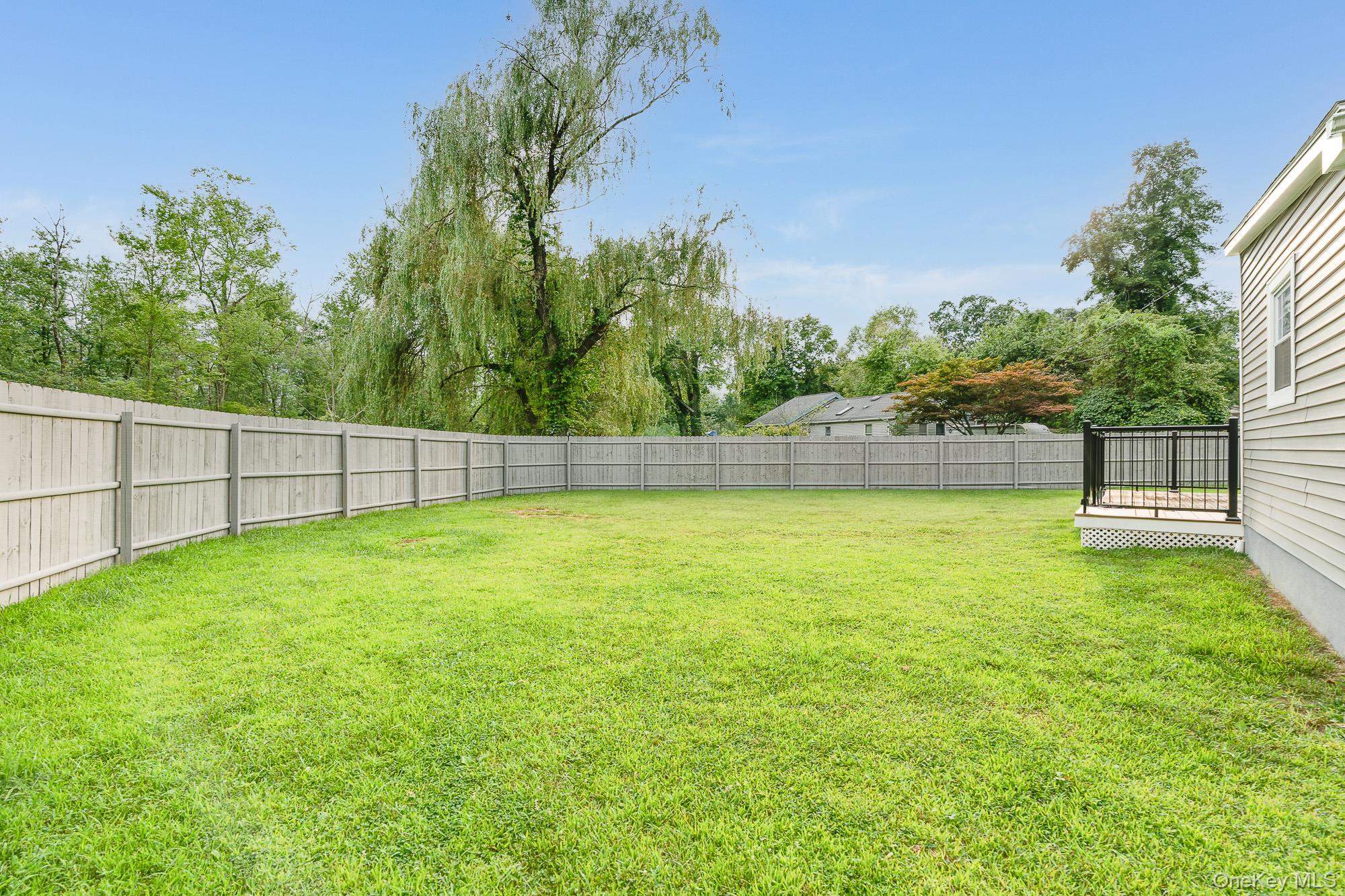 3167 Lincoln Drive Mohegan Lake, NY 10547 - Photo 25 of 34 a view of a yard with an outdoor space