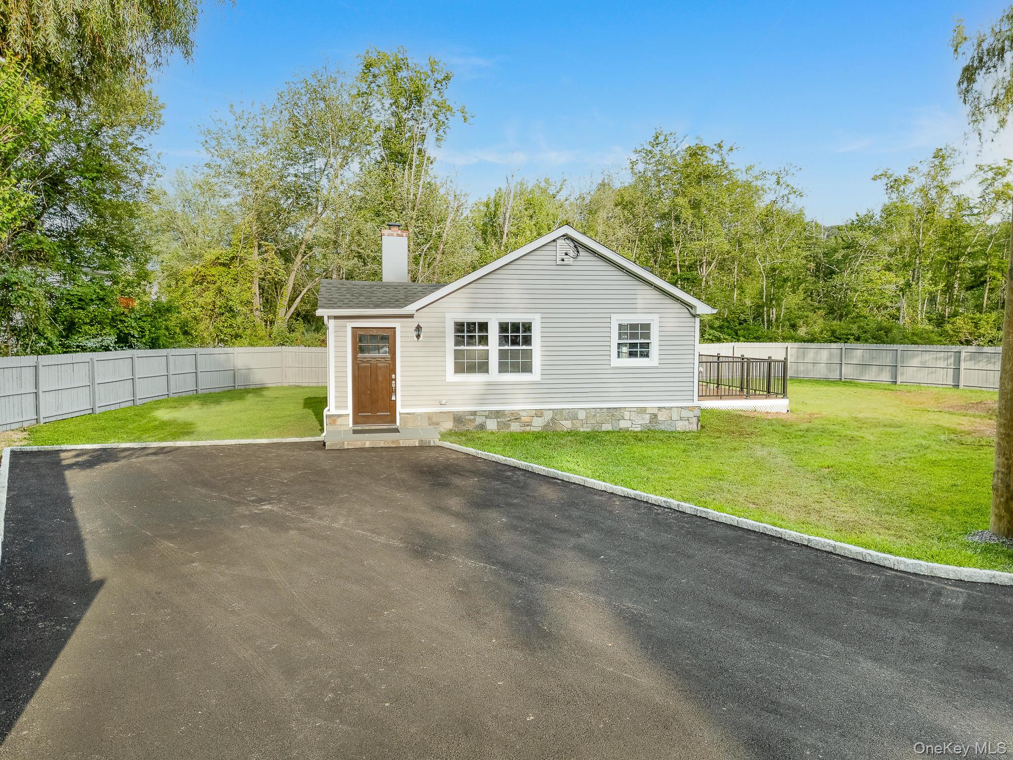 3167 Lincoln Drive Mohegan Lake, NY 10547 - Photo 3 of 34 a view of a house with a yard and a small yard