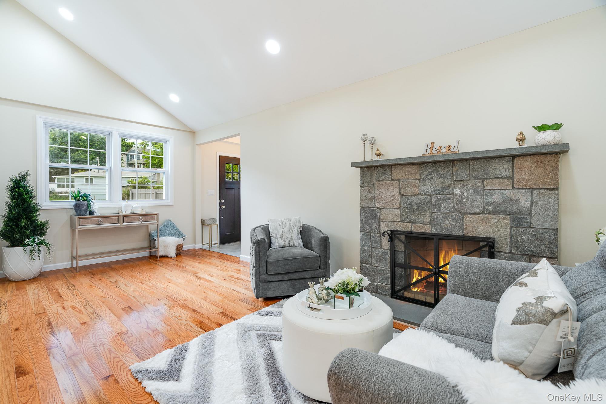3167 Lincoln Drive Mohegan Lake, NY 10547 - Photo 7 of 34 a living room with furniture and a fireplace