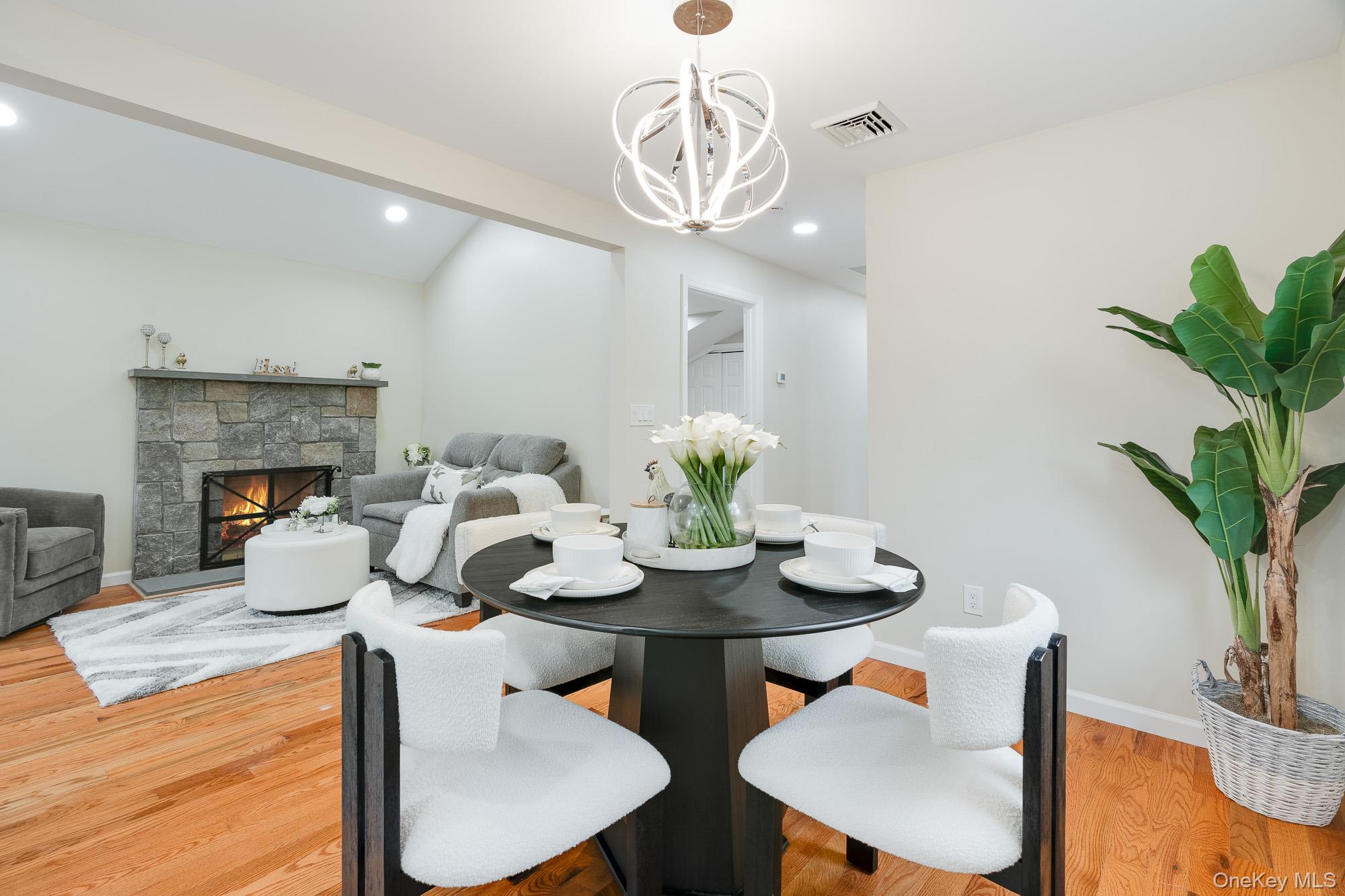 3167 Lincoln Drive Mohegan Lake, NY 10547 - Photo 10 of 34 a view of a dining room with furniture wooden floor and chandelier