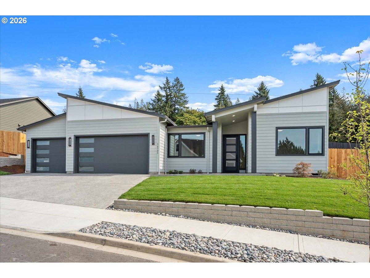 16705 Northeast 38th Avenue Vancouver, WA 98686 - Photo 45 of 45 a front view of a house with a yard and a garage
