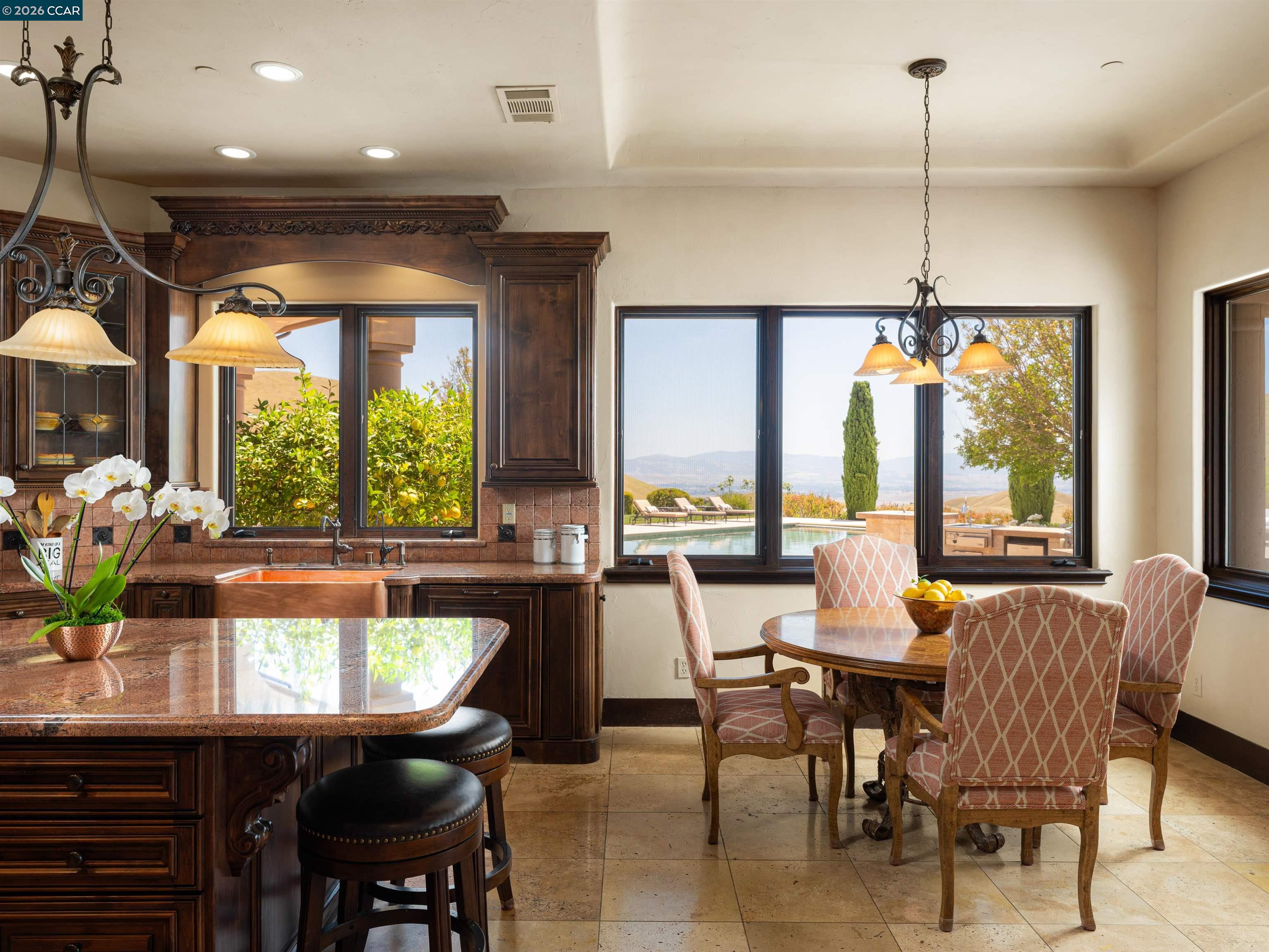 2020 Victorine Road Livermore, CA 94551 - Photo 22 of 99 a dining room with furniture a chandelier and wooden floor