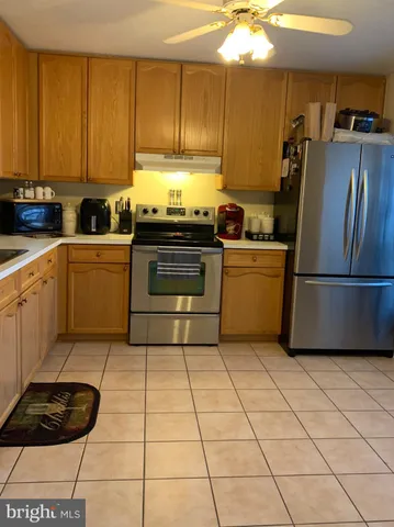 a kitchen with a cabinets and appliances