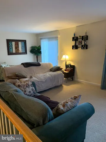 a bedroom with bed and window