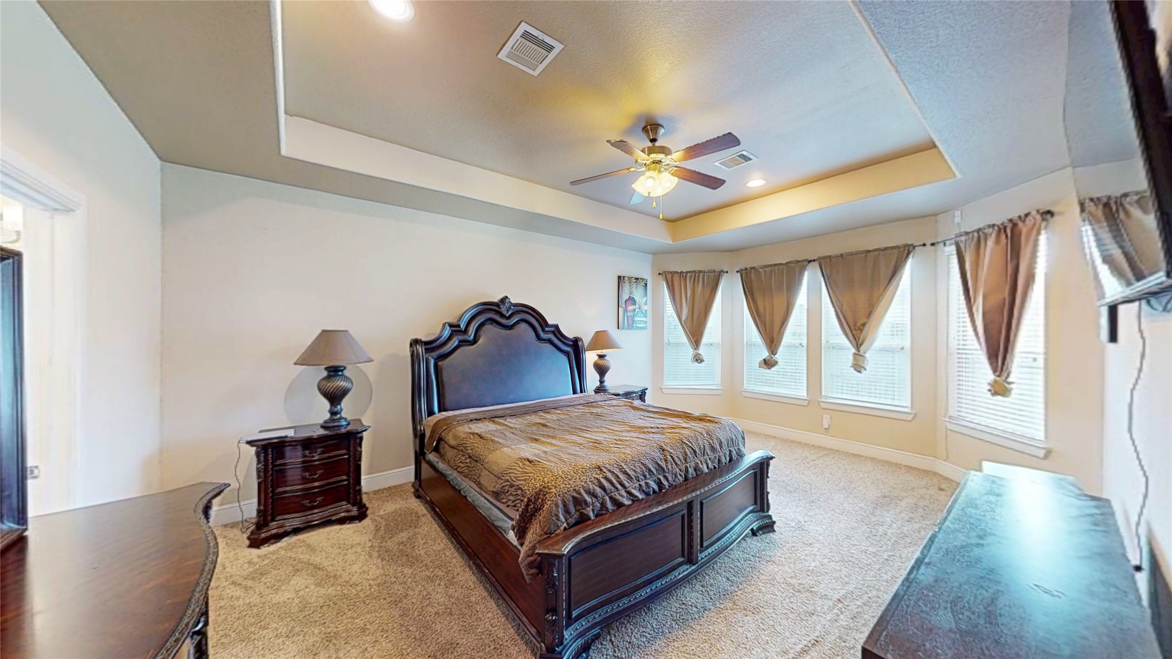 14535 Julie Meadows Lane Humble, TX 77396 - Photo 15 of 35 a bed sitting in a spacious bedroom next to a window