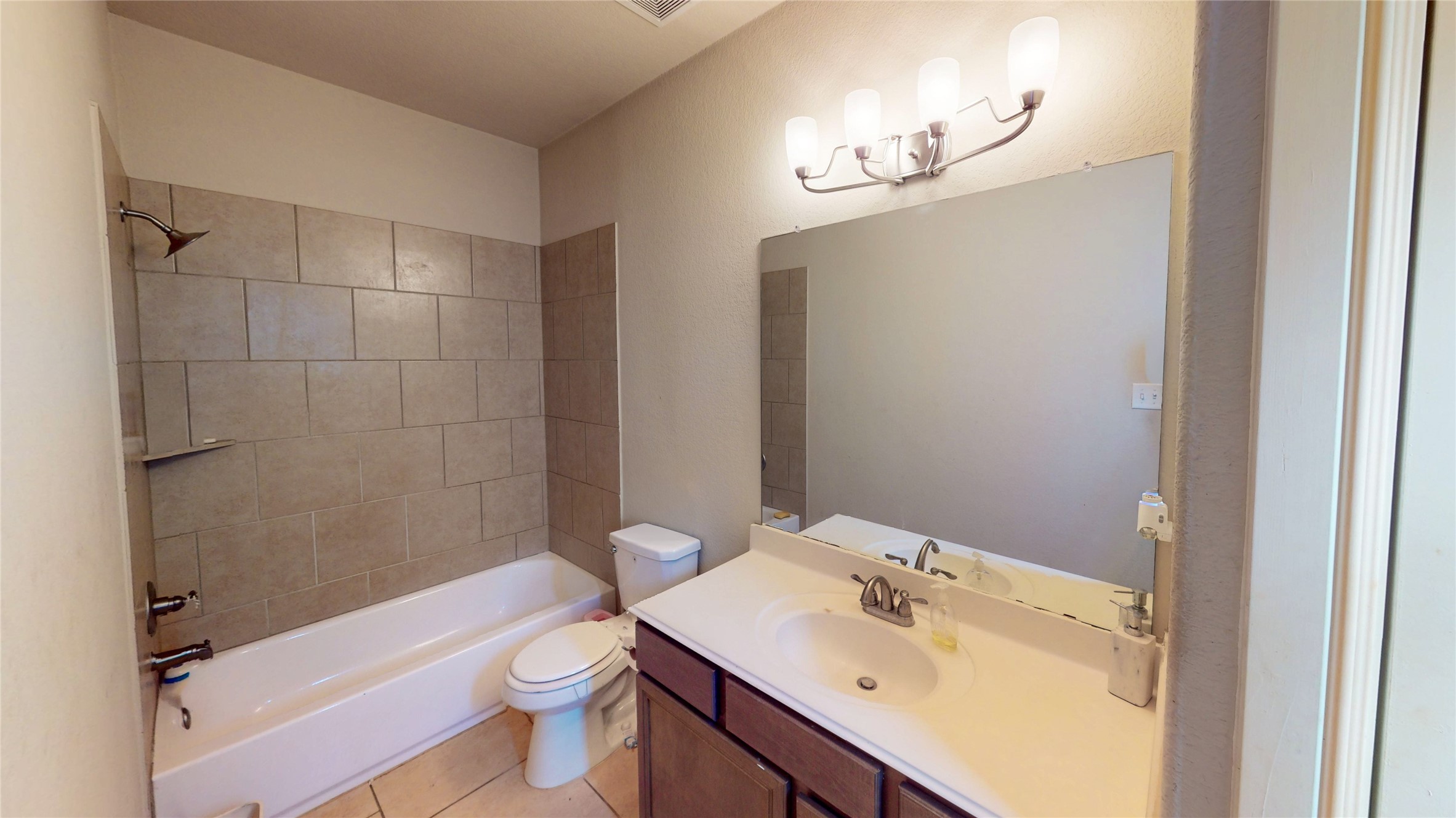 14535 Julie Meadows Lane Humble, TX 77396 - Photo 22 of 35 a bathroom with a sink a toilet and shower