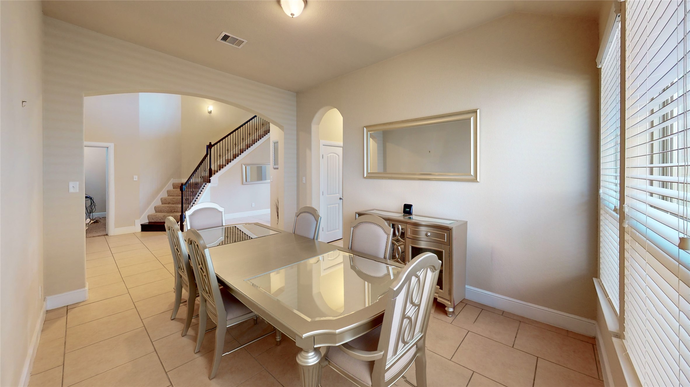 14535 Julie Meadows Lane Humble, TX 77396 - Photo 9 of 35 a view of a dining room with furniture and a window