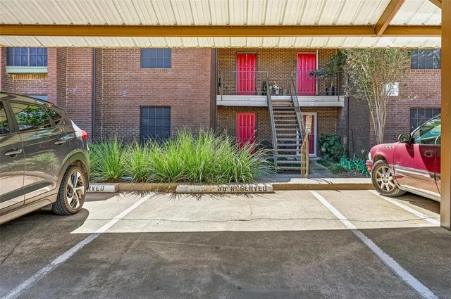 a front view of a house with a yard and a garage