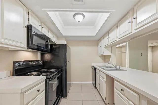 a kitchen with stainless steel appliances granite countertop a stove and a refrigerator