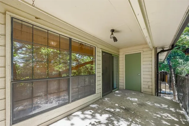 a view of a glass door and porch
