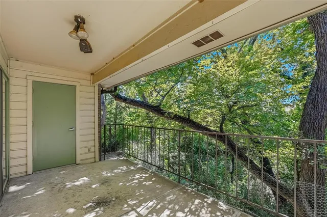 a view of a yard from a balcony