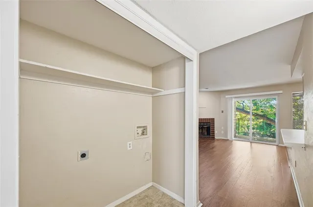 a view of hallway with wooden floor and floors