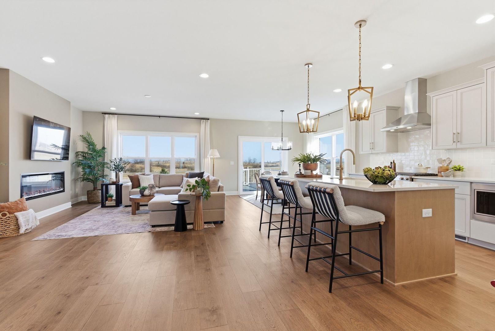 16541 Kayla Drive Lemont, IL 60439 - Photo 12 of 33 a kitchen with stainless steel appliances granite countertop white cabinets a dining table and chairs