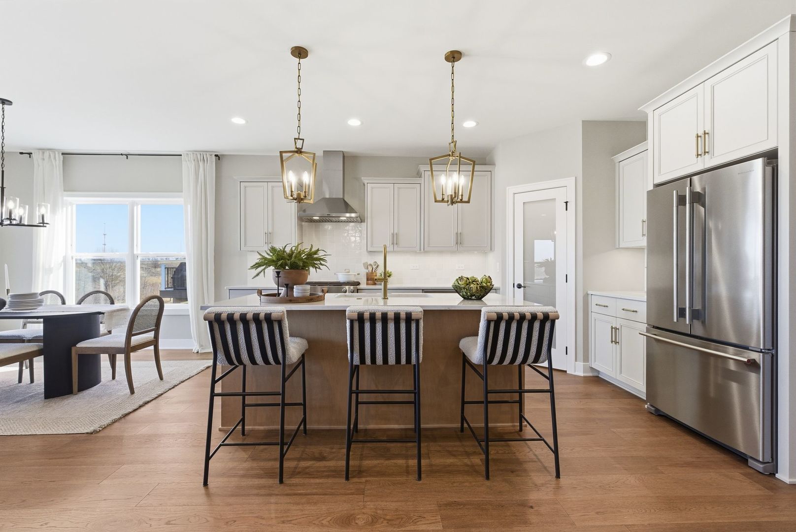 16541 Kayla Drive Lemont, IL 60439 - Photo 14 of 33 a view of kitchen with refrigerator dining table and chairs