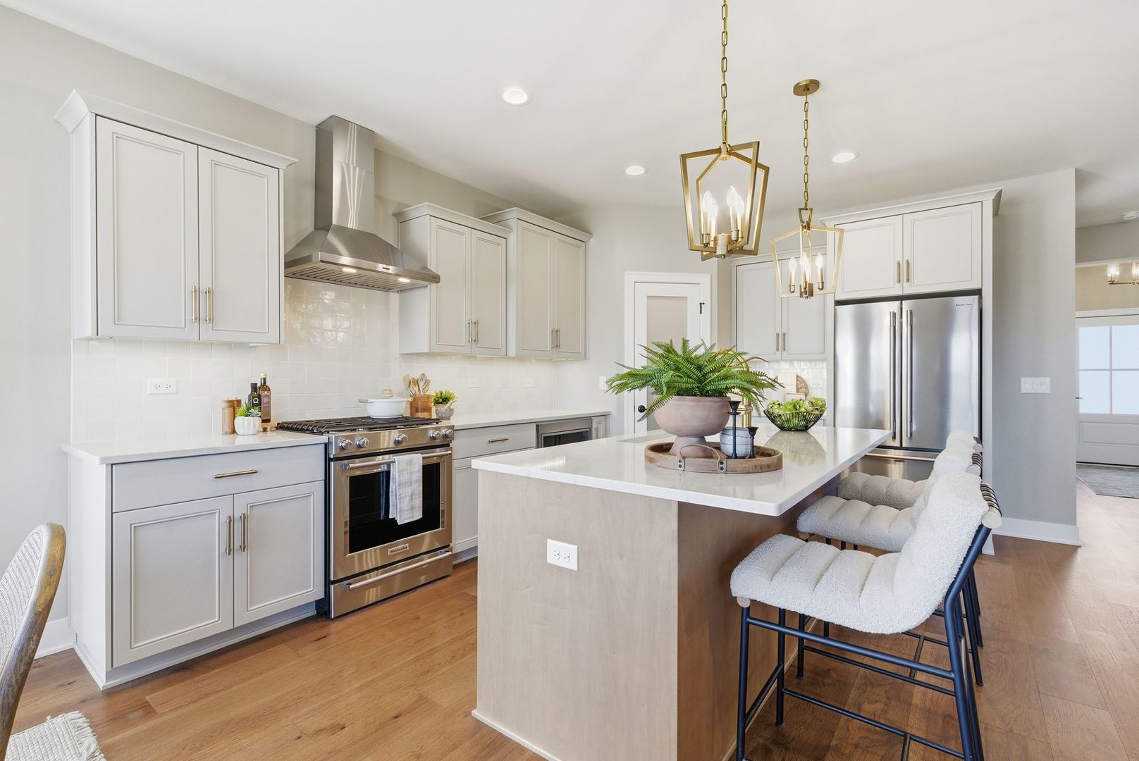 16541 Kayla Drive Lemont, IL 60439 - Photo 15 of 33 a kitchen with stainless steel appliances a stove chandelier and wooden floor