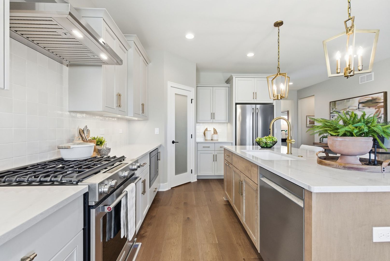 16541 Kayla Drive Lemont, IL 60439 - Photo 16 of 33 a kitchen with kitchen island granite countertop a sink stove and cabinets