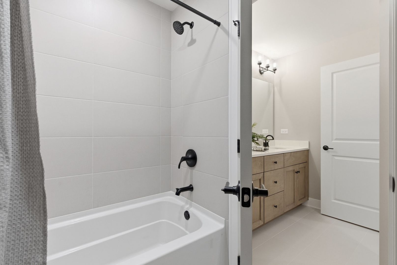 16541 Kayla Drive Lemont, IL 60439 - Photo 28 of 33 a bathroom with a tub sink vanity granite and shower