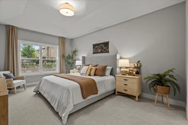 a bed room with a bed and a plant