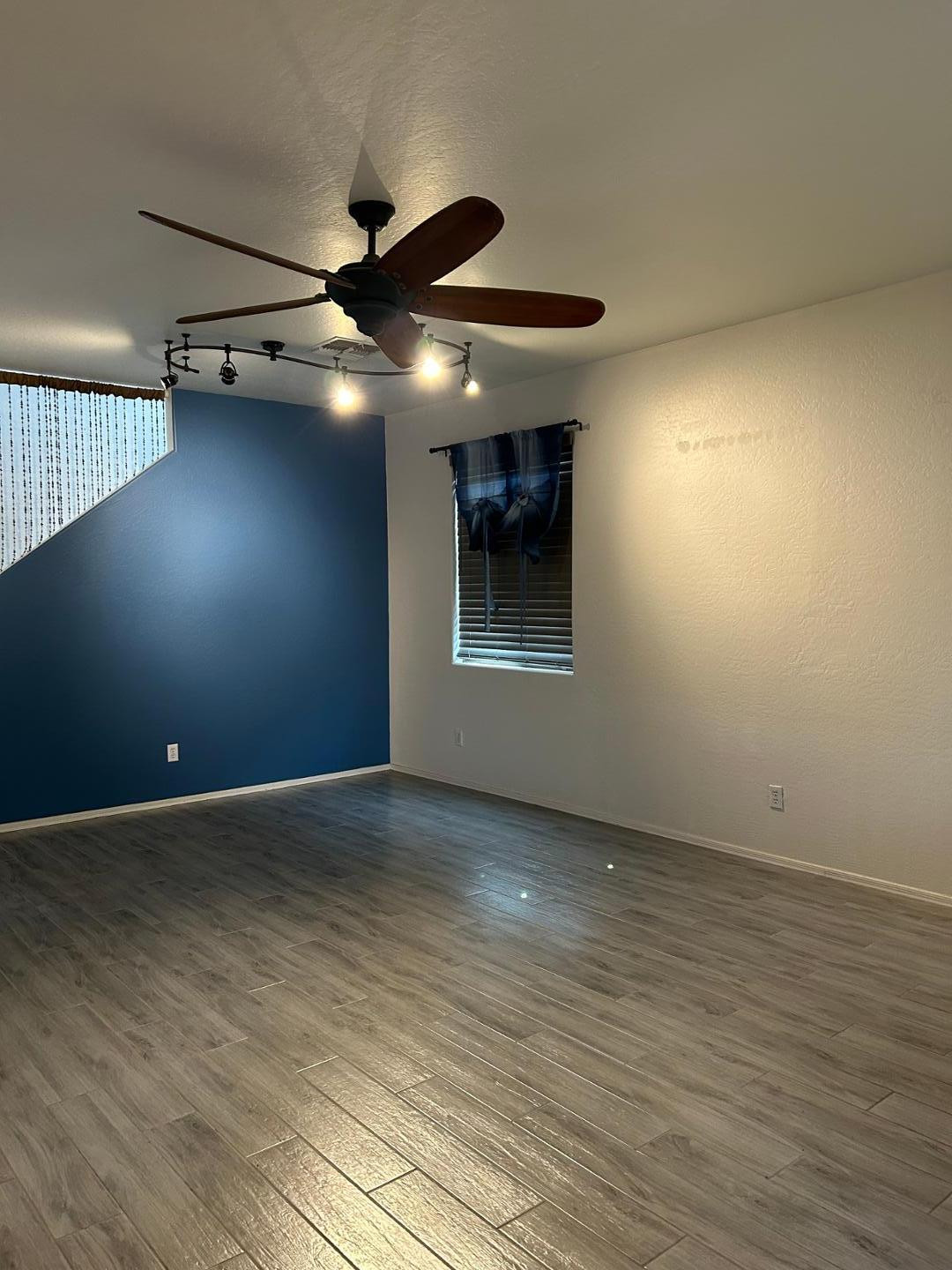 7044 West Alta Vista Road Laveen, AZ 85339 - Photo 3 of 11 a view of an empty room with a window