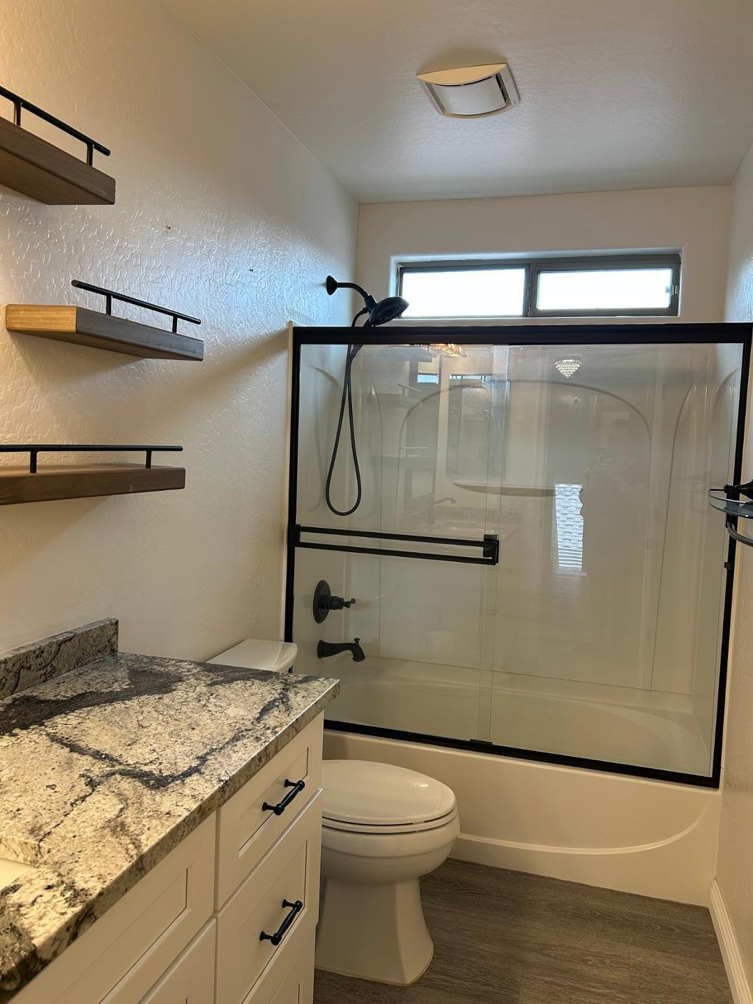 7044 West Alta Vista Road Laveen, AZ 85339 - Photo 5 of 11 a bathroom with a granite countertop sink toilet and shower