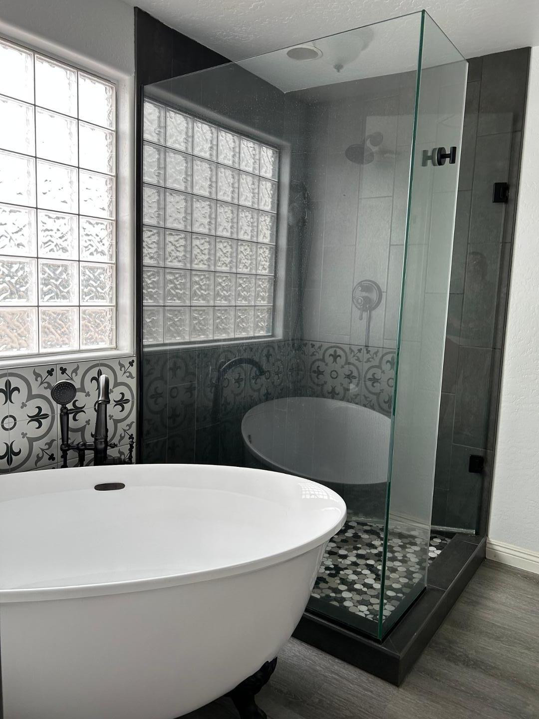 7044 West Alta Vista Road Laveen, AZ 85339 - Photo 7 of 11 a white bath tub sitting in a bathroom next to a window
