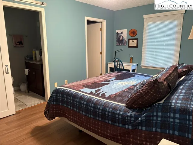 a bathroom with a sink toilet and a mirror