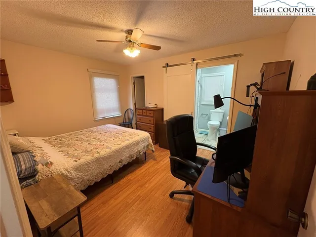 a bedroom with a bed and furniture