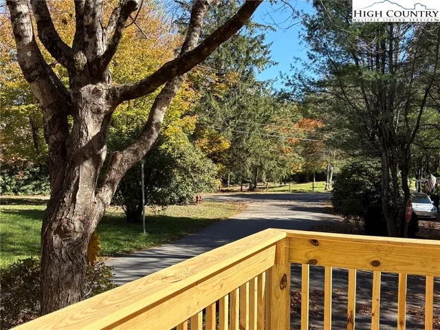 a view of swimming pool with a yard
