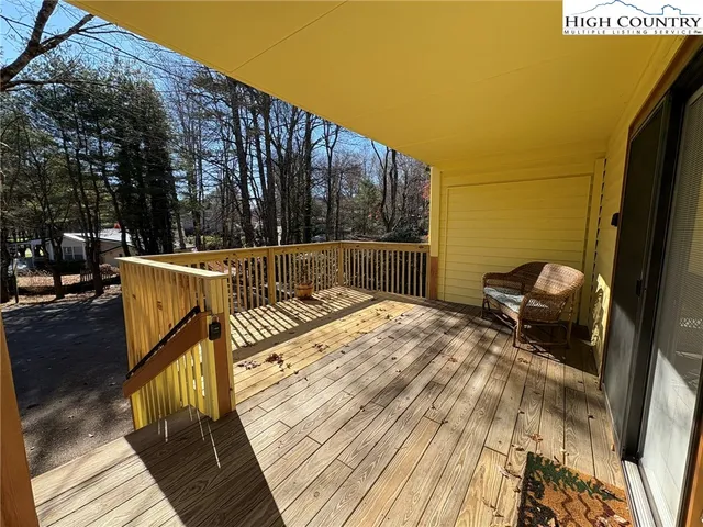 a view of balcony with wooden floor