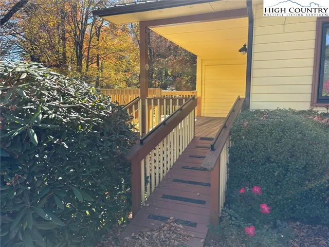 a view of a house with a yard next to a road