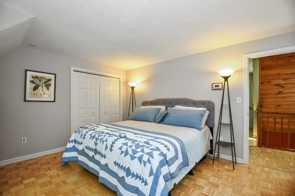 60 Peabody Road, Unit B Shirley, MA 01464 - Photo 15 of 42 a bedroom with a bed and a lamp on table