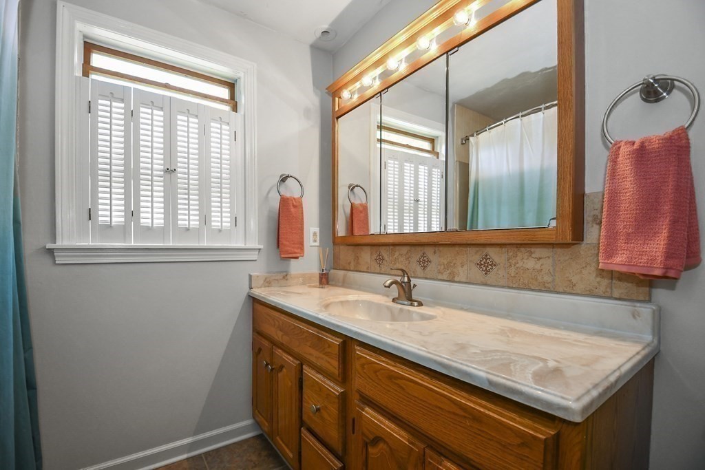 60 Peabody Road, Unit B Shirley, MA 01464 - Photo 17 of 42 a bathroom with a sink and a mirror