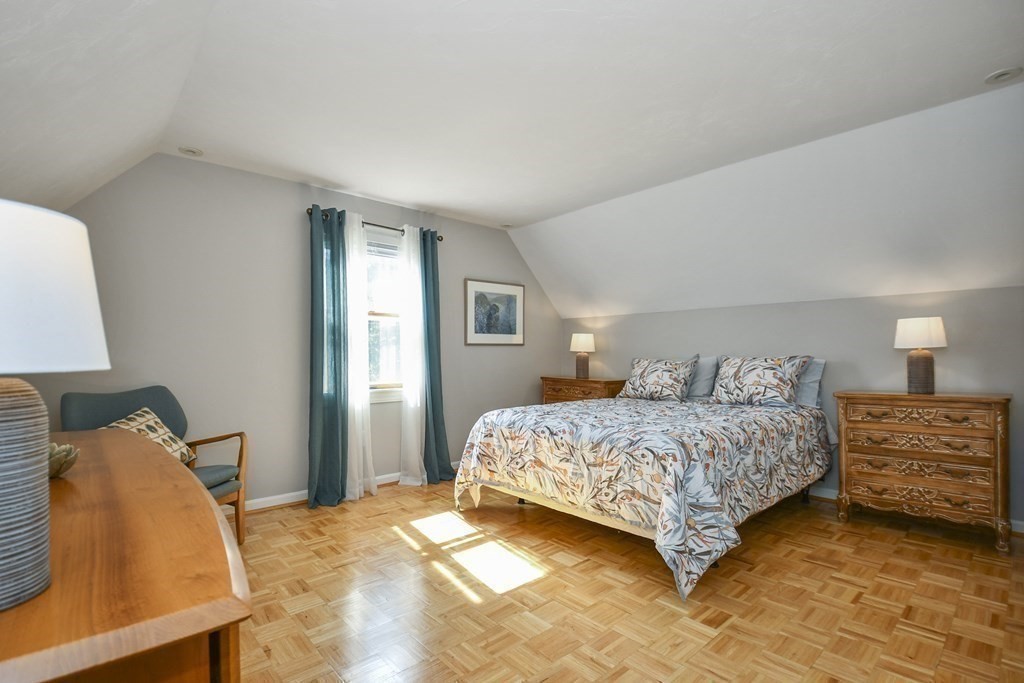 60 Peabody Road, Unit B Shirley, MA 01464 - Photo 19 of 42 a bedroom with a bed and a lamp