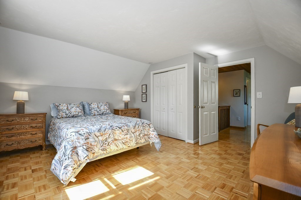 60 Peabody Road, Unit B Shirley, MA 01464 - Photo 20 of 42 a bedroom with a bed and a lamp
