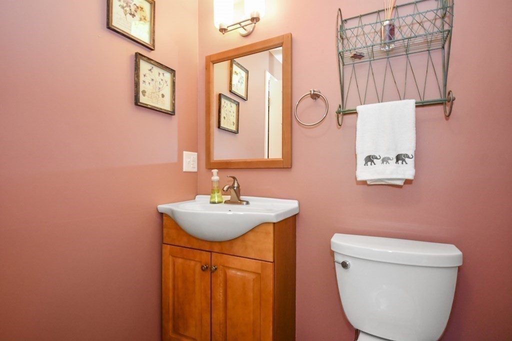 60 Peabody Road, Unit B Shirley, MA 01464 - Photo 28 of 42 a bathroom with a toilet sink and mirror