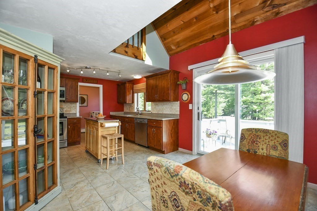 60 Peabody Road, Unit B Shirley, MA 01464 - Photo 4 of 42 a kitchen with stainless steel appliances granite countertop a stove a sink and a refrigerator