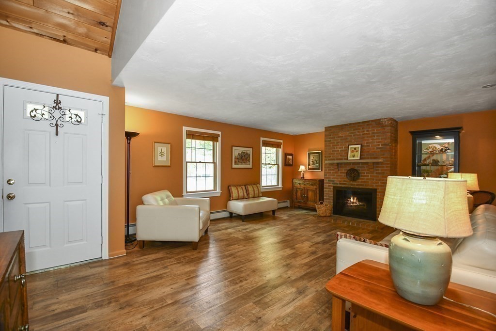 60 Peabody Road, Unit B Shirley, MA 01464 - Photo 7 of 42 a living room with furniture and a fireplace