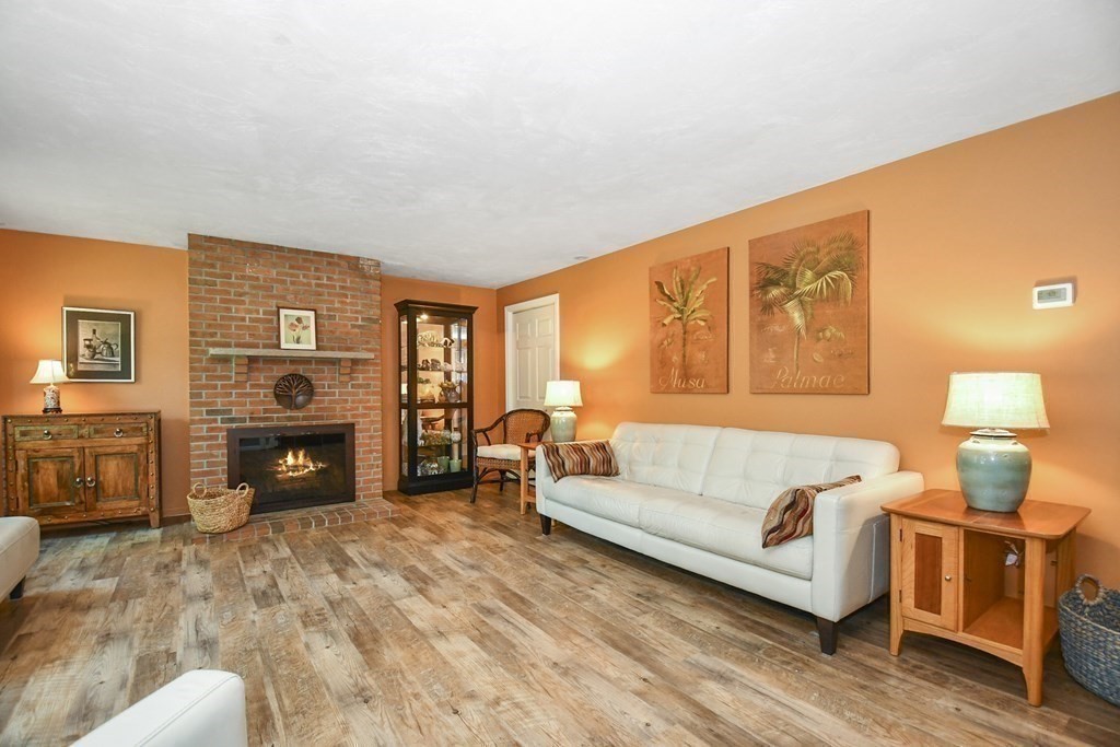 60 Peabody Road, Unit B Shirley, MA 01464 - Photo 8 of 42 a living room with furniture and a fireplace