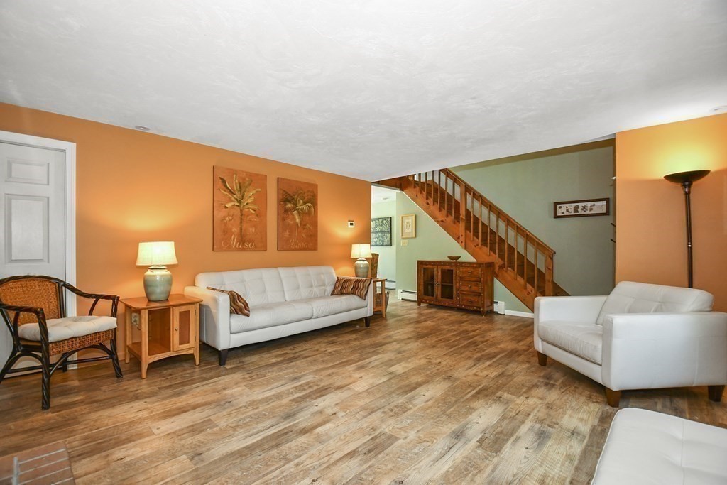 60 Peabody Road, Unit B Shirley, MA 01464 - Photo 9 of 42 a living room with furniture and stairs