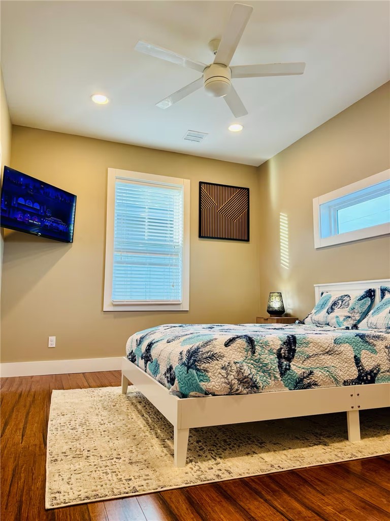 14310 Ridley Way Corpus Christi, TX 78418 - Photo 15 of 19 a bedroom with a bed and wooden floor