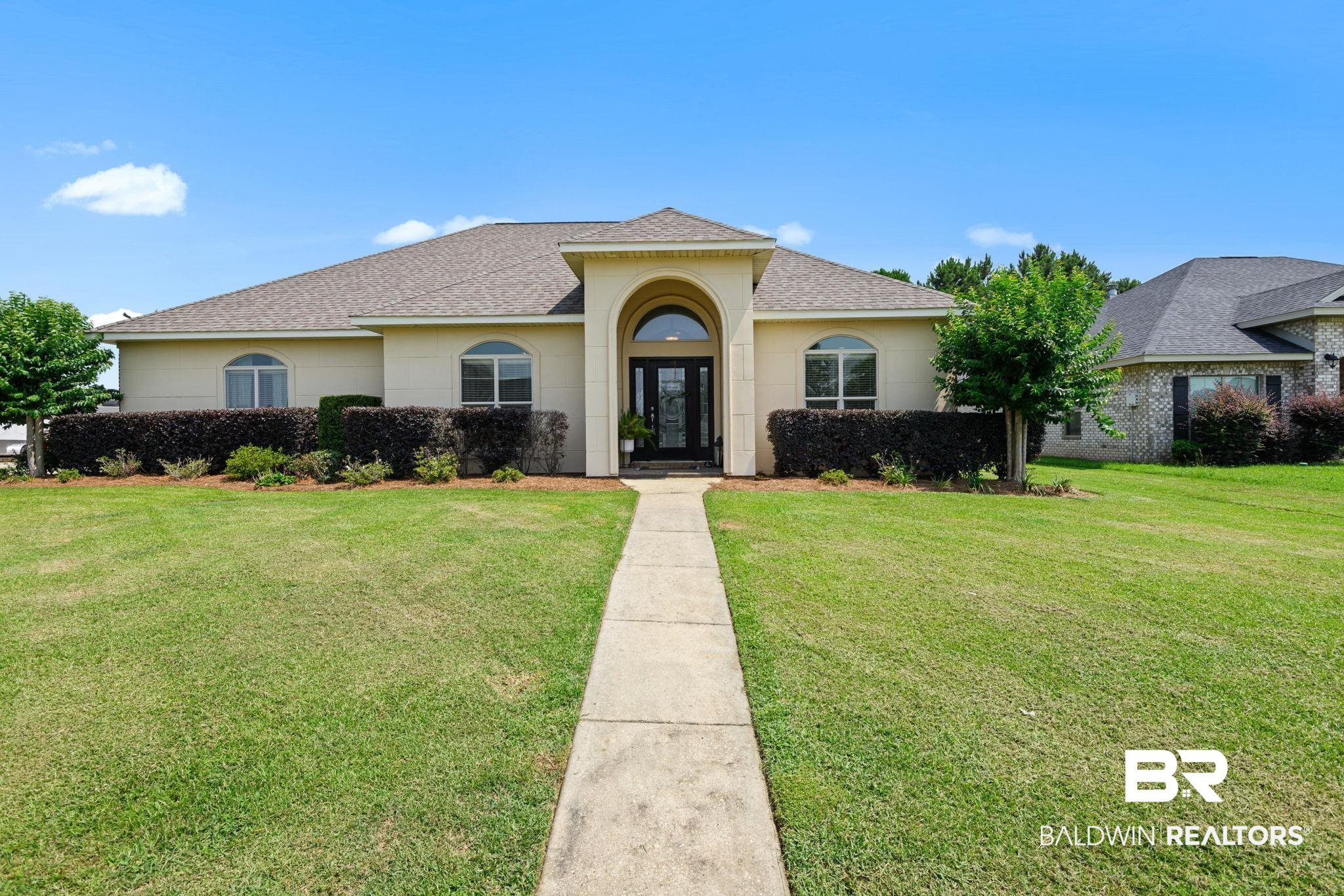 9730 Harmony Ridge Circle West Semmes, AL 36575 - Photo 1 of 38 View of front of property featuring a shingled roof, a front lawn, and stucco siding