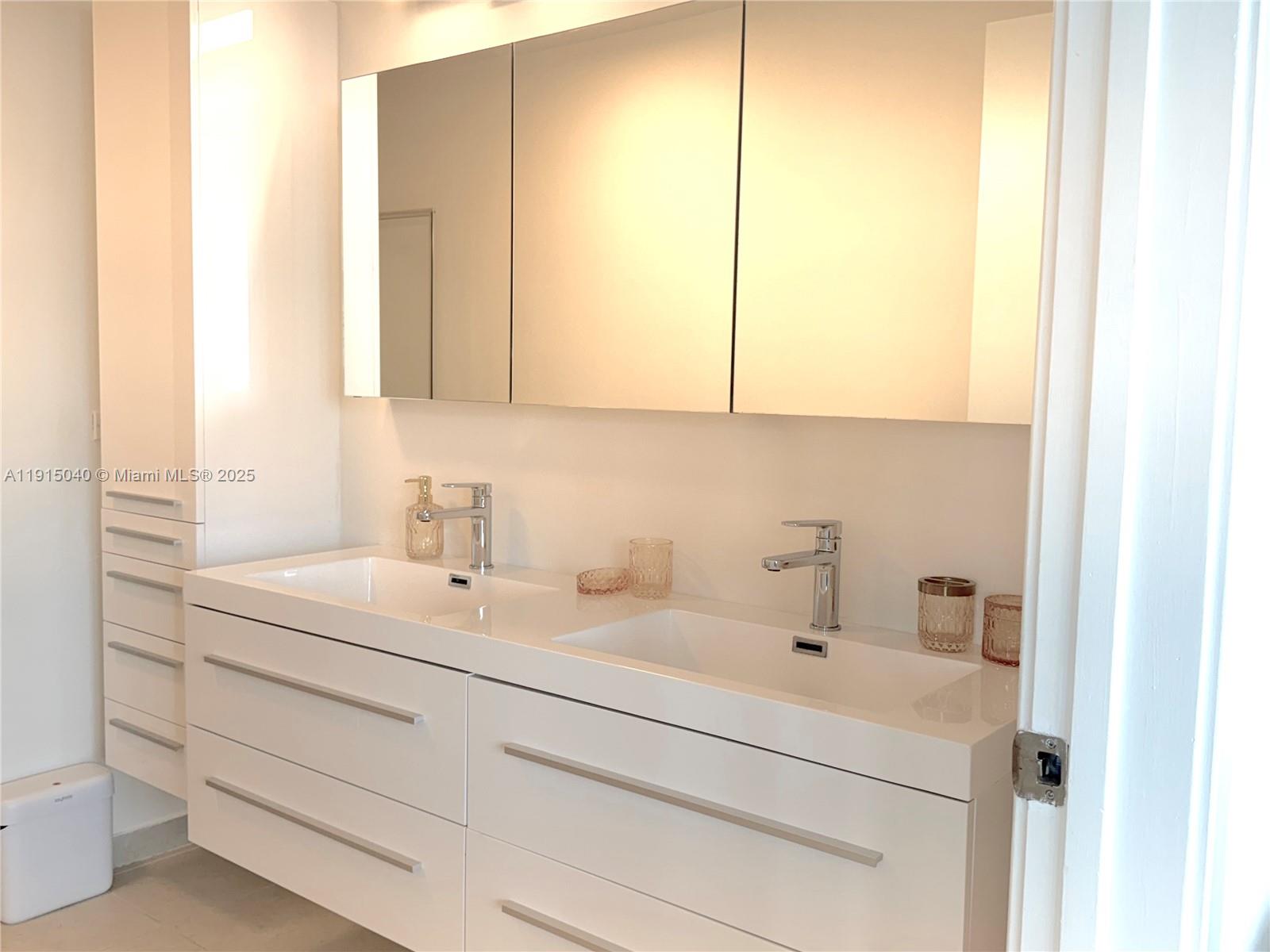 3301 Northeast 1st Avenue, Unit H3001 Miami, FL 33137 - Photo 20 of 53 a bathroom with a sink and a mirror