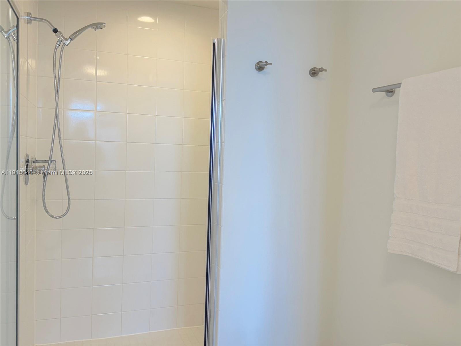 3301 Northeast 1st Avenue, Unit H3001 Miami, FL 33137 - Photo 22 of 53 a bathroom with a glass shower door