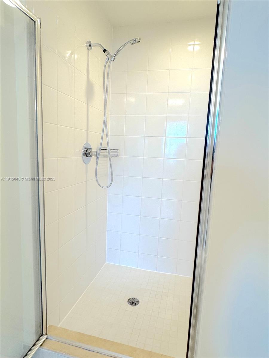 3301 Northeast 1st Avenue, Unit H3001 Miami, FL 33137 - Photo 23 of 53 a bathroom with a glass shower door