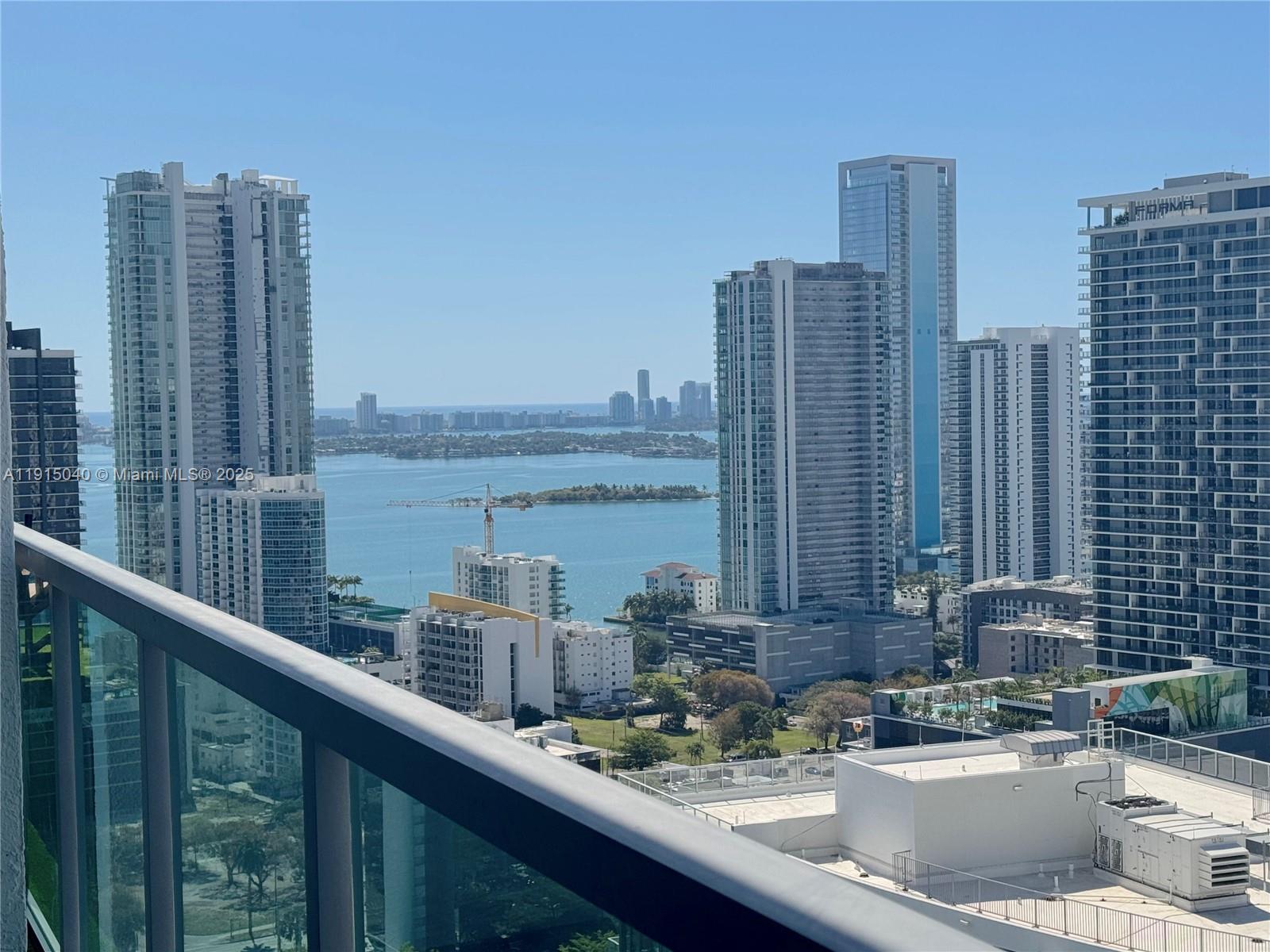 3301 Northeast 1st Avenue, Unit H3001 Miami, FL 33137 - Photo 29 of 53 a view of a city skyline from a balcony