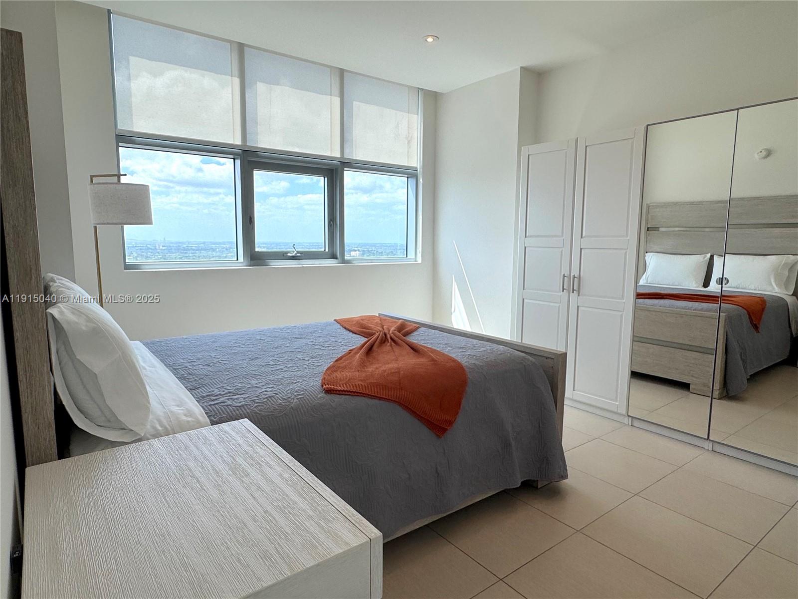 3301 Northeast 1st Avenue, Unit H3001 Miami, FL 33137 - Photo 34 of 53 a living room with furniture and a window