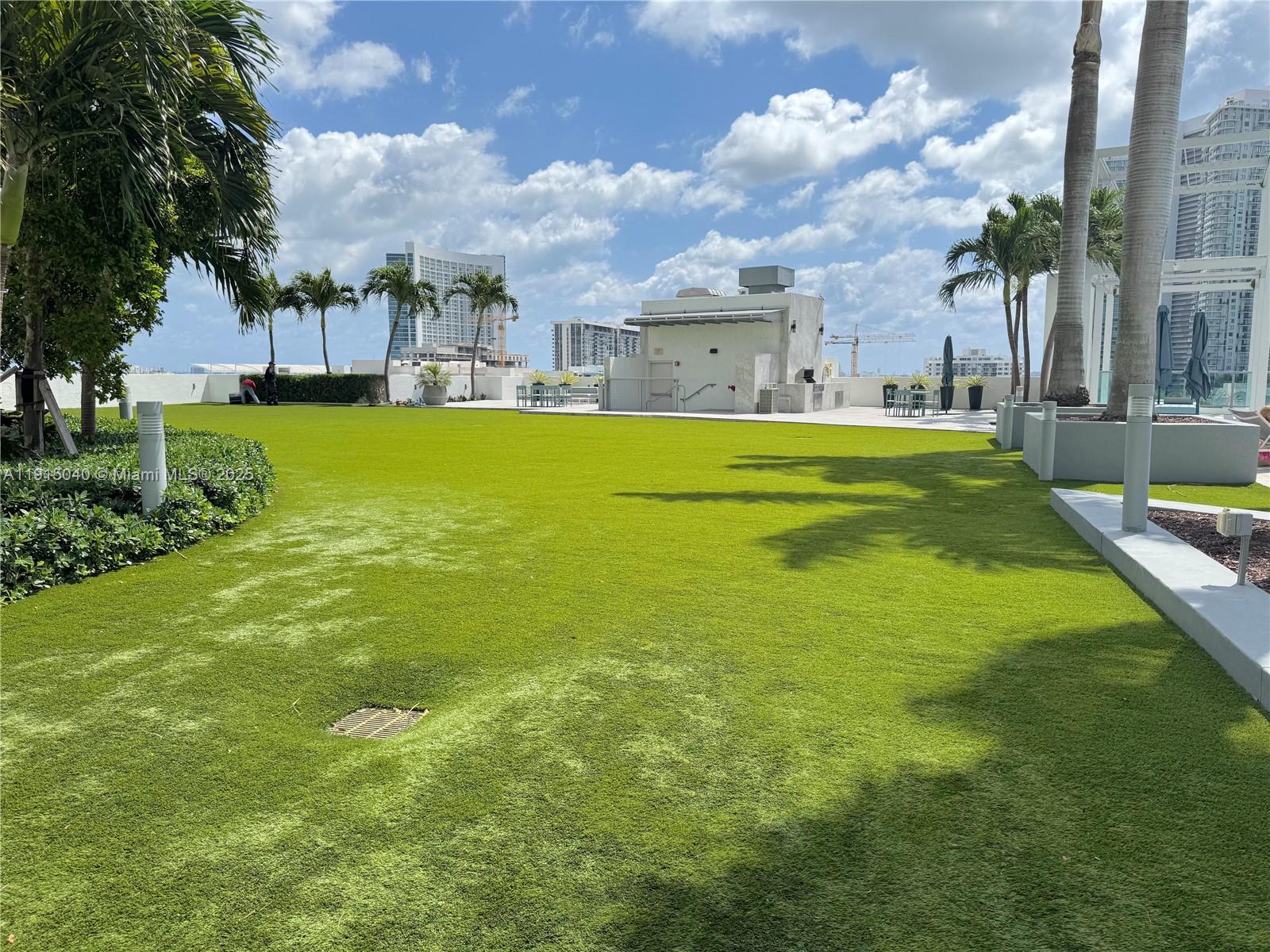 3301 Northeast 1st Avenue, Unit H3001 Miami, FL 33137 - Photo 43 of 53 a swimming pool with outdoor seating and yard