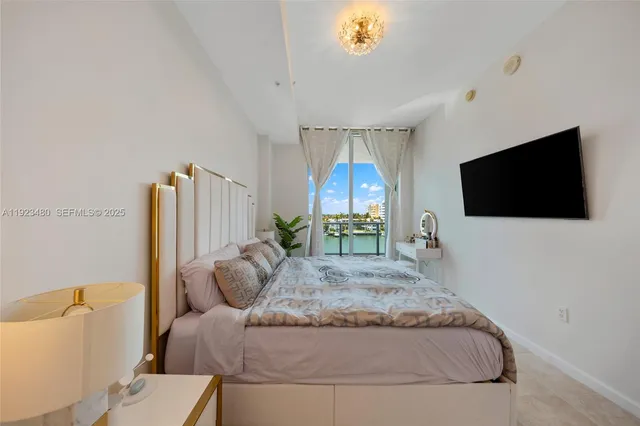 a bathroom with a sink and mirror with toilet