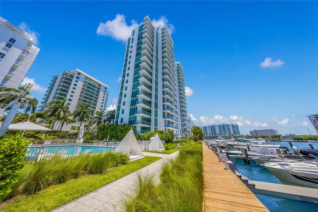 a living room with furniture and floor to ceiling window